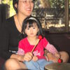 child has one beater, mother has the other for floor tom